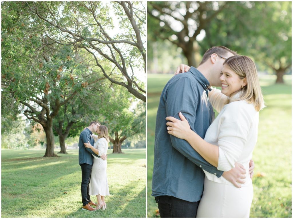 Couple embracing in Lakewood Park surrounded by trees