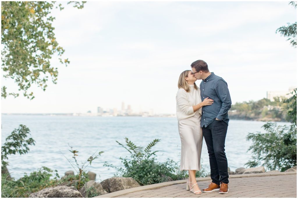 Couple posing in Lakewood Park for overlooking Cleveland Ohio.