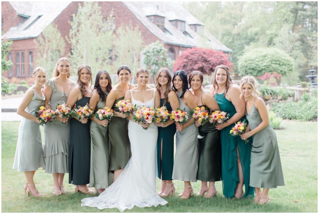 a bride with her bridesmaid's on her wedding day