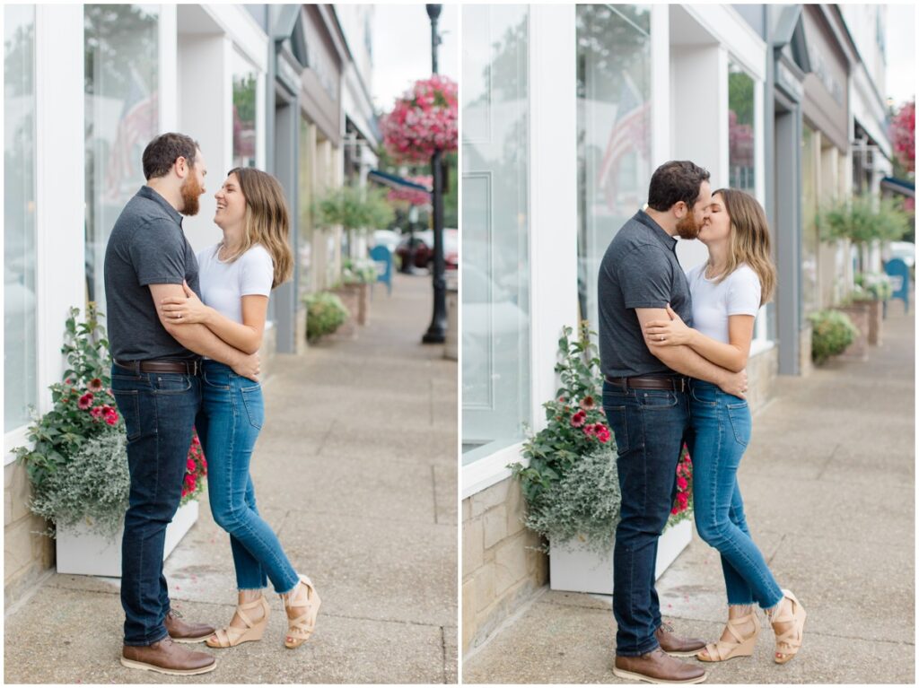 a couple posing in front of a storefront in downtown chagrin falls