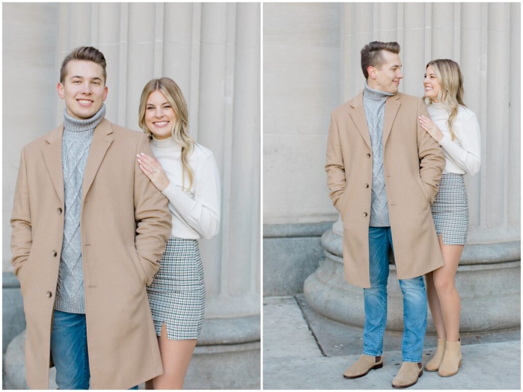 An engaged couple posing outside Terminal Tower in Cleveland Ohio for their engagement session